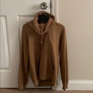 Tan turtle neck/hoodie sweater.
